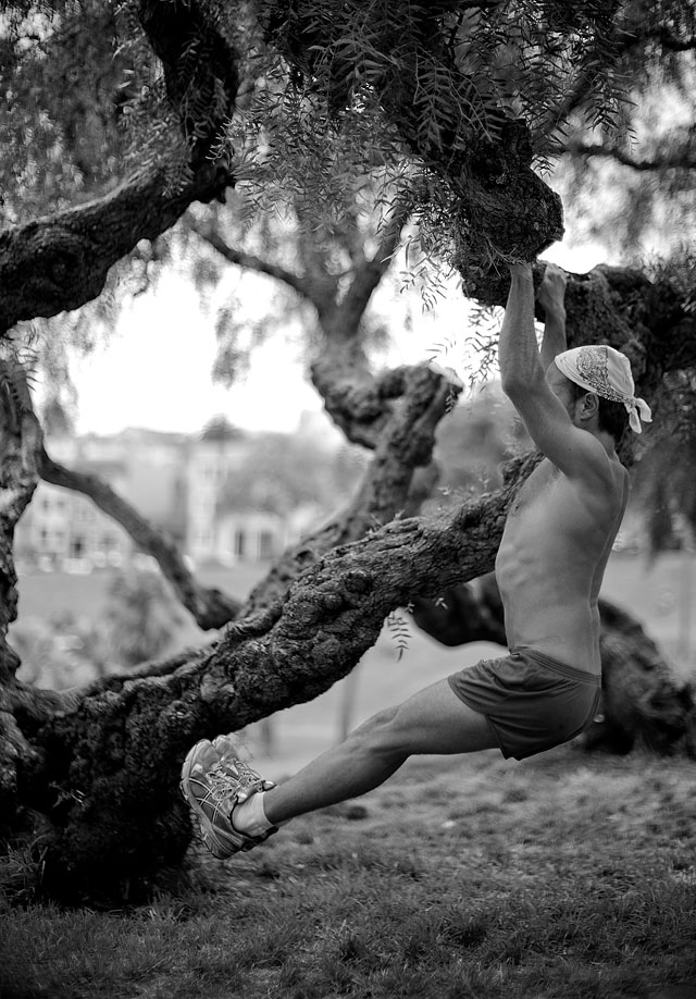 A fanatic runner performs a few athletic routines in a park in San Francisco. © 2013-2016 Thorsten Overgaard.   