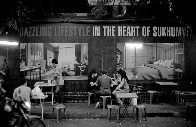 Dazzling Lifestyle in Bangkok, Thailand. A street restaurant with a poster behind for an upcoming luxory building. Leica M 240 with Leica 50mm Noctilux-M ASPH f/0.95.