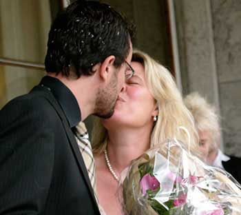 A first kiss as a married couple - with rice in the hair