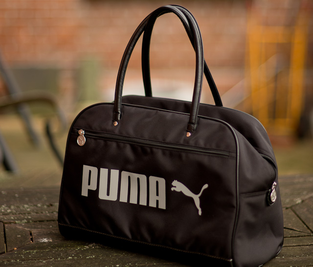 The less expensive PUMA gym bag made into a camerabag for travel. With a Billingham insert for the camera, lenses and accessories such as hard drives, lightmeter, batteries, etc. you are set for under $100. Same size as the Gucci bag above. The one in the photo is a limited edition, but they keep coming with new editions every year. 