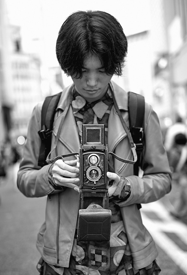 Stranger in the street of Tokyo with his film camera. Leica 50mm APO-Summicron-M ASPH f/2.0. © Thorsten Overgaard. 