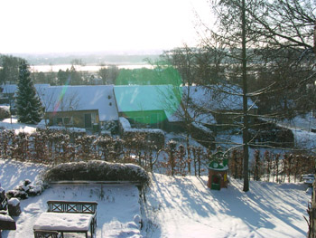 View from the annex of Villa Nøjsomheden to the Brabrandsøen, January, 2003 where one can see the first row of three rows of houses beuilt in the former park. Here is how the park looked in 1956 fro the bottom of the garden: