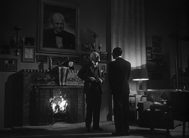 Elegant lit scene where the parts of the persons in shadow has a contra light behind them to define the shape so they never disappear. Citizen Kane (1941, cinematography by Gregg Toland, directed by Orson Welles).