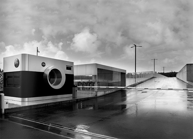 The entrance to Leica Camera in Porto in Portugal featuer this large Leica M camera that houses the security. 

