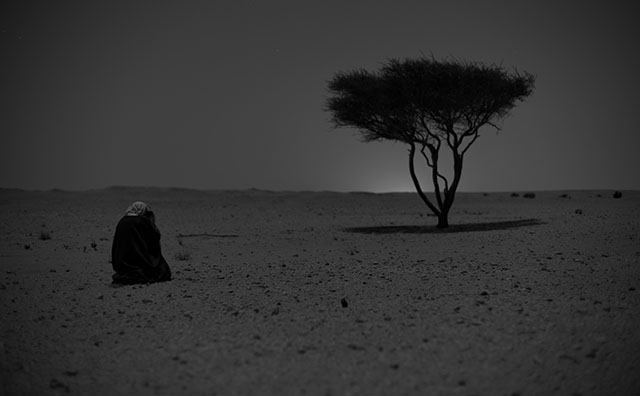 Khalid Al-Thani photographing a landscape with tripod by moonlight