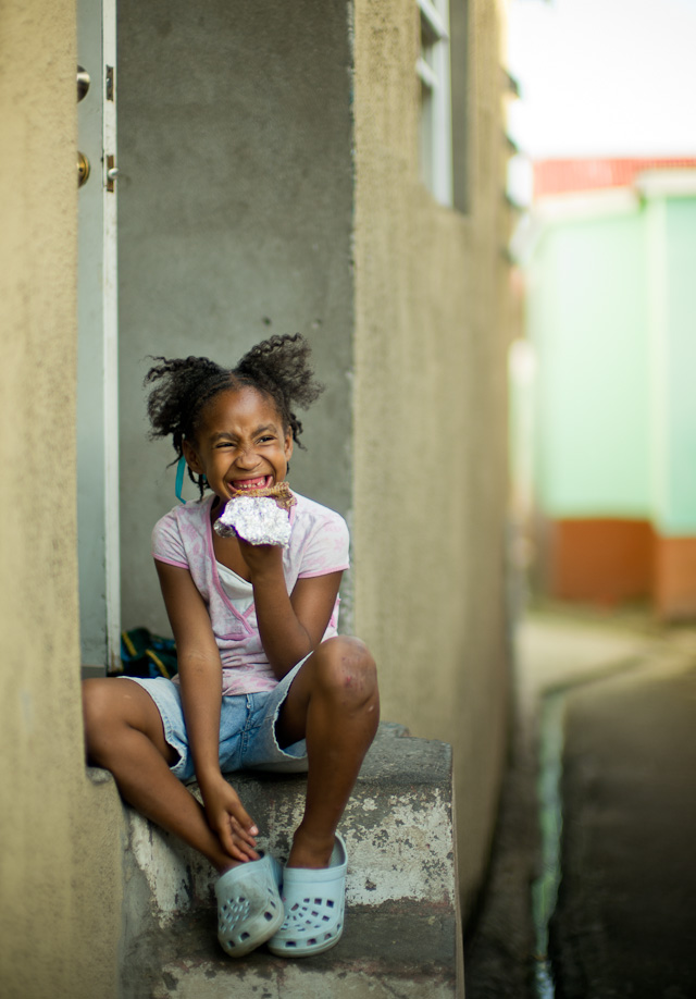 The daughter sat down to eat, so I waited untill she couldn't ignore me anymore. She was shy of course.Leica M Type 240 with Leica 50mm Noctilux-M ASPH f/0.95. © 2014 Thorsten Overgaard.