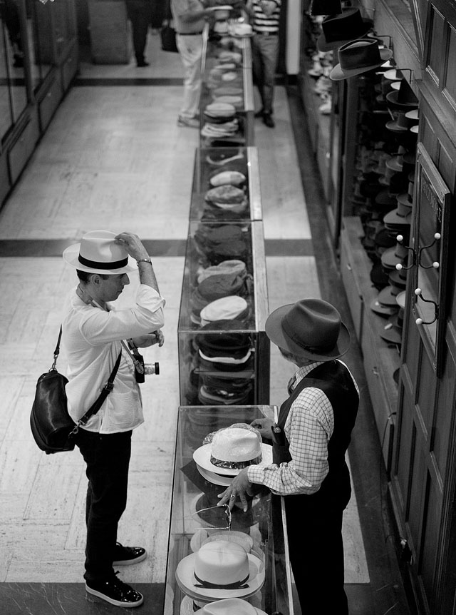The workshop trying on a hat in JJ Hat Center on 5th Avenue. Photo by Thorsten Overgaard.