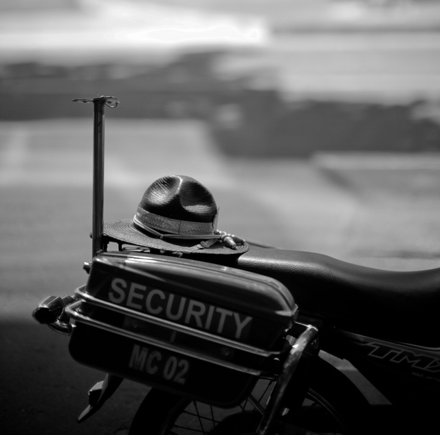 The officer parked his bike and hat. Leica M 240 with Leica 50mm Noctilux-M ASPH f/0.95. © Thorsten Overgaard.