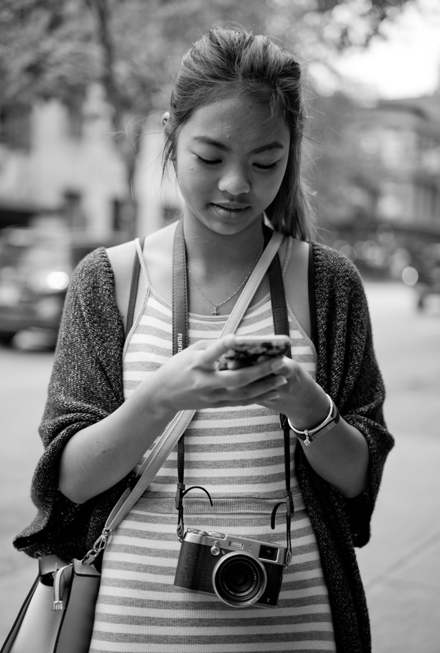 Girl out and about with her Fuji in Vancouver. Leica M-D 262 with Leica 50mm APO-Summicron-M ASPH f/2.0. © 2016 Thorsten Overgaard. 