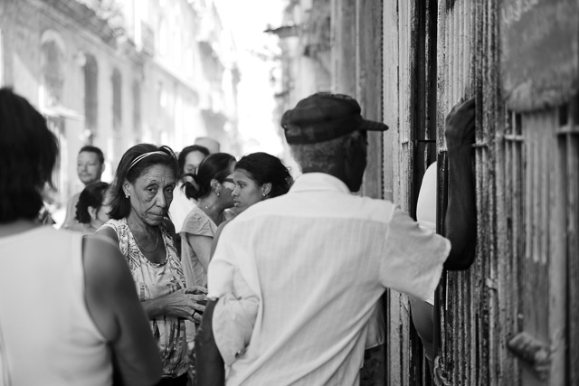 I saw this large group of people outside a hole in the wall of an old building. It turned out to be a butcher selling meat. It looked like they had limited supplies, it was almost over by the time I looked into the room. It didn't make much sense to me as all hotels and restaurants seem to have ample supplies of meat. Leica M10 with Leica 50mm APO-Summicron-M ASPH f/2.0. Copyright 2017-2018 Thorsten von Overgaard. 