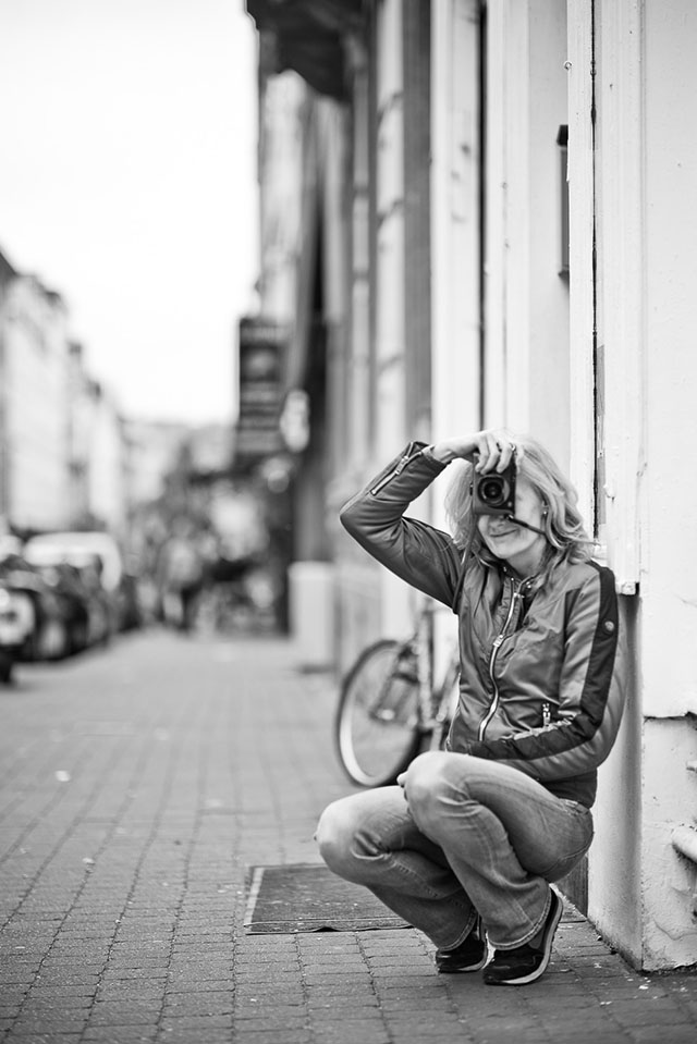 Ms. Kolner with the red Leica Q in the Brussels Workshop. Leica M10 with Leica 75mm Noctilux-M ASPH f/1.25. © 2018 Thorsten von Overgaard.