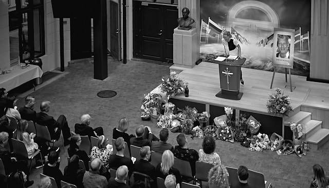 Goodbye to Jørgen Madsen: If your life was a party, the funeral can be a blast. Many friends were sharing stories from a rich life of Jørgen Madsen at the memorial in Church of Scientology in Copenhagen, making the farewell the party he had requested. In this photo Stinne Danneskjold Siracusano is telling about when Jørgen was traveling on an airplane, getting into the trouble you can only dream of: A stellar moment in aviation history and typical of Jørgen's life. There was many grand moments in his life, fast uphill and roaring downhill, making the farewell an uplifting remembrance. Leica M10-P with Leica 50mm APO-Summicron-M ASPH f/2.0. © Thorsten Overgaard. 