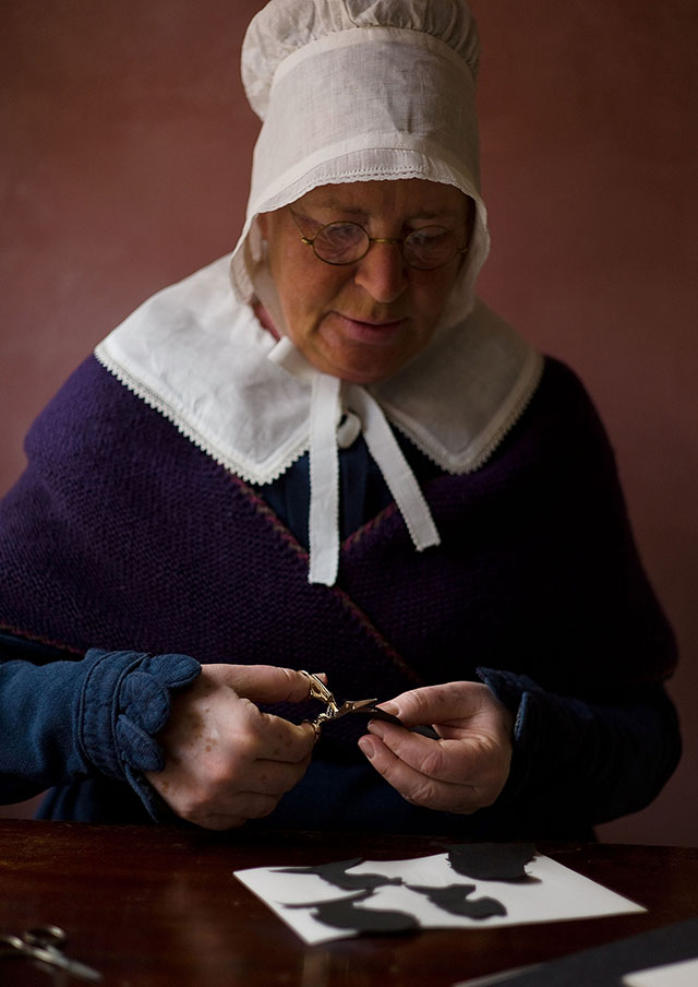 Clipping, coloring and gluing together Christmas decorations is a tradition. Here from a shoot I did to illustrate how this art was performed back in the time of H. C. Andersen. Leica M9. © Thorsten Overgaard.