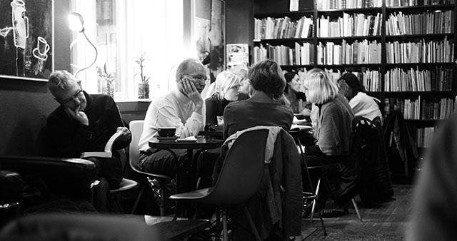 Denmark 2009: The "hygge" concept is to be indoor with cozy lights, drink coffee, read and talk while it is dark and cold outside. As in this cafe in Denmark. Leica M9. © Thorsten Overgaard.
