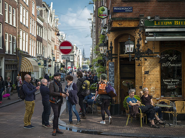 Thorsten von Overgaard lost in the street amidst tourists and evening sun in Amsterdam. Photo by Mathijs Mennen. 