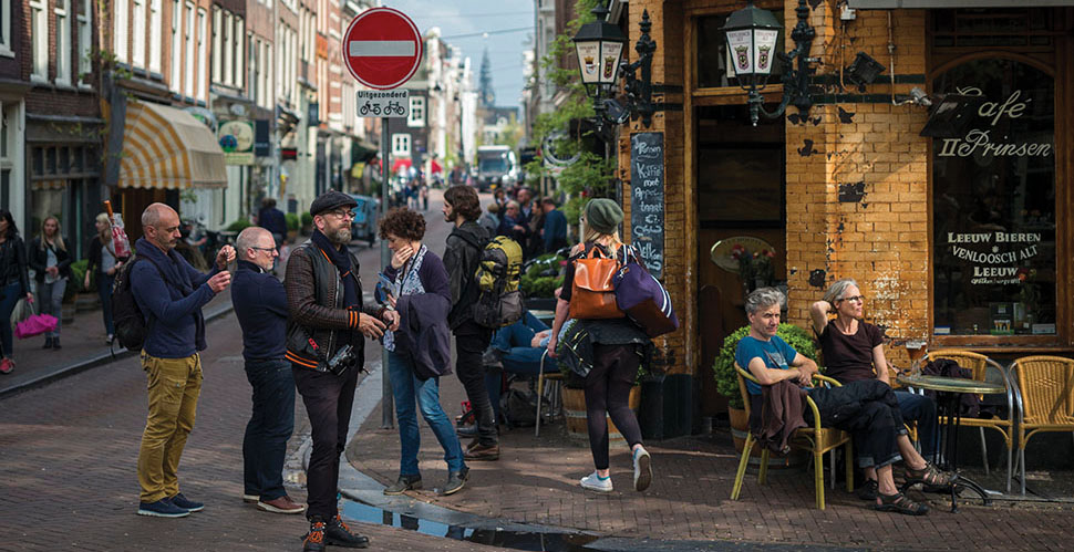 Thorsten von Overgaard lost in the street amidst tourists and evening sun in Amsterdam. Photo by Mathijs Mennen. 