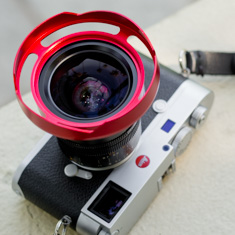 Ventilated shade in RED for the Leica 21mm Summilux-M ASPH f/1.4. 