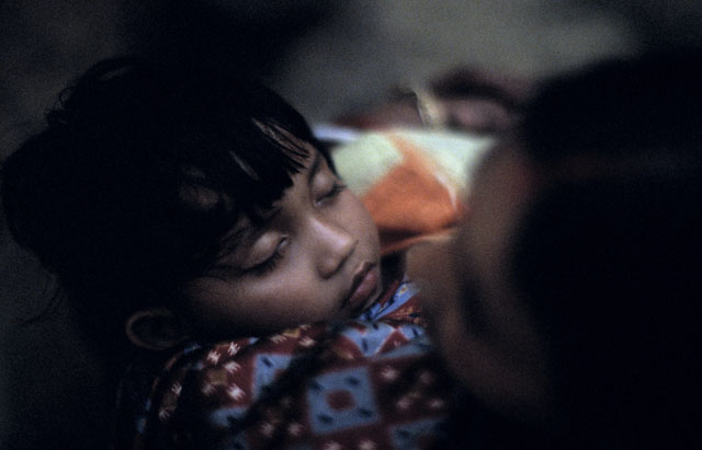 A child sleeping with his mother in Kolkata, India. Leica SL with Leica 80mm Summilux-R f/1.4. L© Thorsten Overgaard. 


