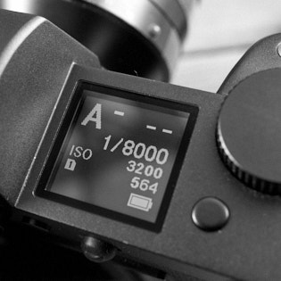 Leica SL2 Top Display

The top display of the Leica SL2 is backlit and lights up in the dark. The A in this photo stands for Aperture Priority, and that mode can be changed by pressing in and rotating the thumbs wheel.

It futher shows the shutter speed 1/8000, what the ISO is set to, and 

If the camera is connected via Bluetooth to a phone, the displays show what as well, and it shows if GPS is on or not. 