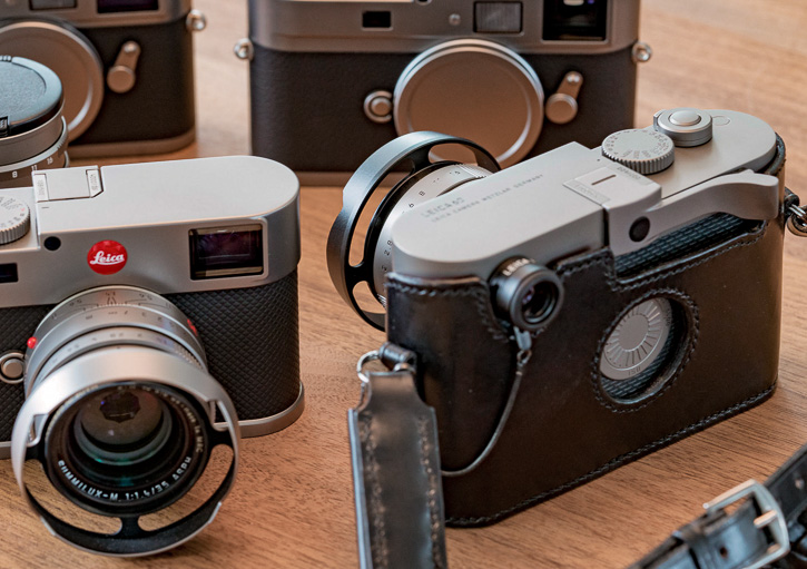 Leica M60 with the ventilated lens shade on the Leica 35mm FLE. Silver to the left, black to the right.