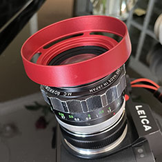 The #9020 also fits the 55mm filter thread on the Minolta Rokkor f/1.2 