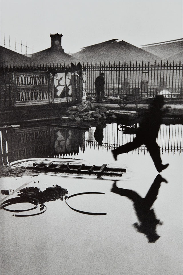 Henri Cartier-Bresson's famous photo "Behind Gare Saint-Lazare". I have a print of this photo from 1983 when American Express supoorted photography and arranged a photo exhibition of HCB pictures. 