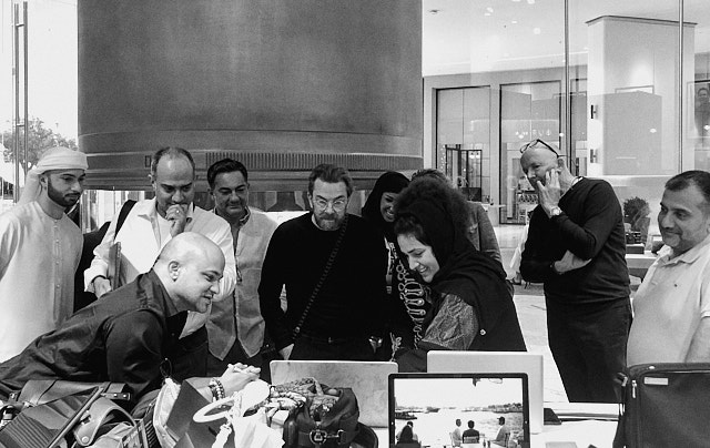 Admiring workshop photos in the Leica Store Dubai. 