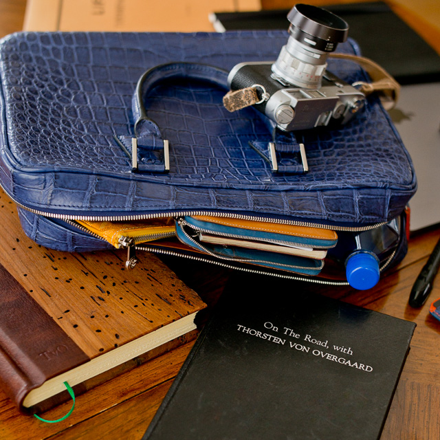 Handmade Epica leather journal in black. To the left is another Epica Wood Cover journal (see photo below). In the bag you can see a little of the Hermes Globe Trotter with zipper (That one fits a calendar and notepad, or a notepad and an iPad Mini. I find the Hermes Ulyssee Notebook more practical because it's soft and with thicker paper). 