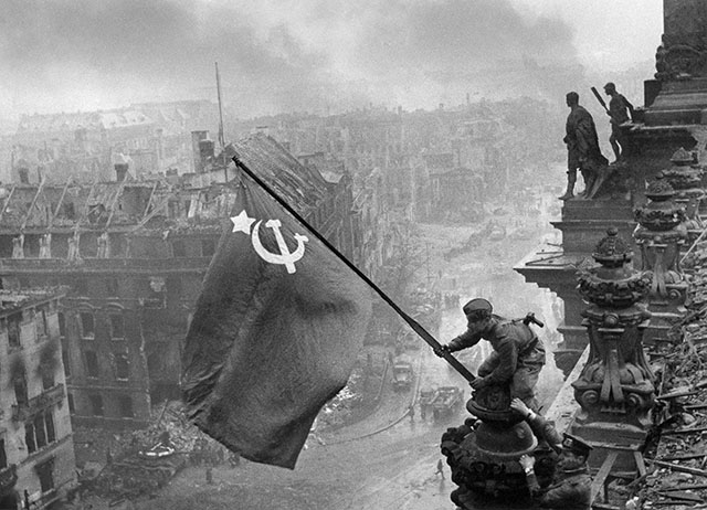 This famous phototaph, "RAISING A FLAG OVER THE REICHSTAG" was taken on May 2, 1945 by Jewgeni Chaldej (1917-1997) with his Leica III with Leitz Elmar 3.5cm f/3.5 (the camera was later sold for $193,000 in an 2014 auchtion). Jewgeni Chaldej (Yevgeny Khaldei) was a Soviet Red Army naval officer and photographer. His father and three of his four sisters were murdered by the Nazis during the war.