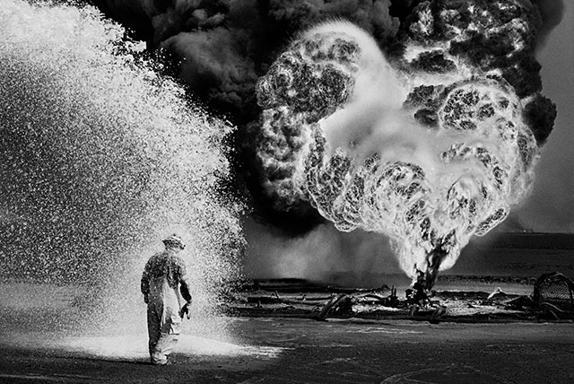 Sebastião Salgado (1944 Brazil - 2025 Paris) was a Brazilian documentary photographer who traveled in more than 120 countries for his photographic projects, often using Leica M6, Canon EOS-1V, as well as medium format cameras like the Pentax 67 and the Mamiya 7. He won the Oskar Barnack Award 1985 and 1992. The above photo is from the Greater Burhan Oil Field, a series on the Kuwait oil fires in 1991 started by Iraq, made with Leica R6 and the Leica 60mm Macro-Elmarit-R 60 mm f/2.8. The movie Salt of the Earth (2014 by Juliano Ribeiro Salgado and Wim Wenders) documents his work as a photographer and preserving wild fauna and landscapes. 