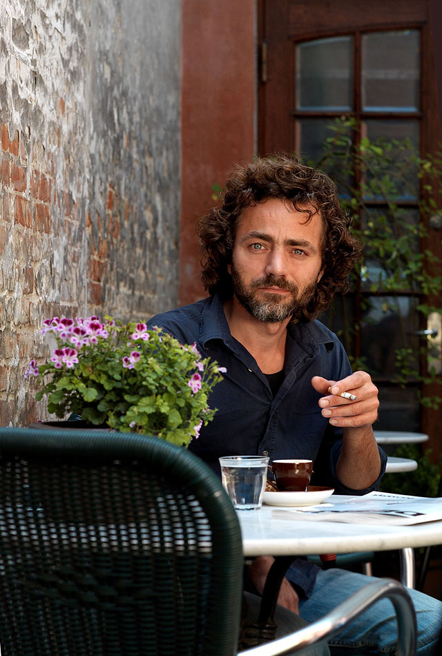 Thomas Sigfred, master barista and owner of Sigfred's Coffee Bar in Denmark. For magazine article 2009. Leica R9 with Leica DMR, 80mm f/1.4. Summilux-R @ f/5.6, 200 ISO. The DNG-file converted using Imacon/Hasselblad Flexcolor 4.8.6. 100cm (3ft) gold reflector from the right.