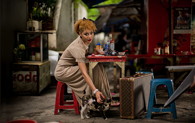 Joy Villa modelling in Jakarta, Indonesia for the workshop, with a LV suitcase as decoration