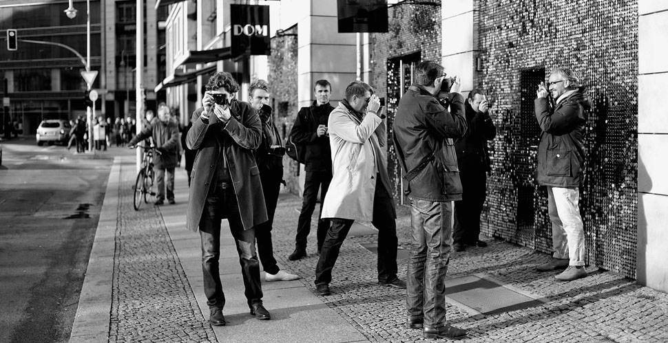 The seminar group playing with reflections in Berlin.