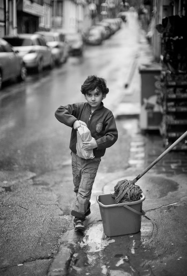 The boy in the restaurant was sent next door to buy milk. You know that when they go in, they eventually have to come out again. That's how you do it. Leica M Type 240 with Leica 50mm Noctilux-M ASPH f/0.95.