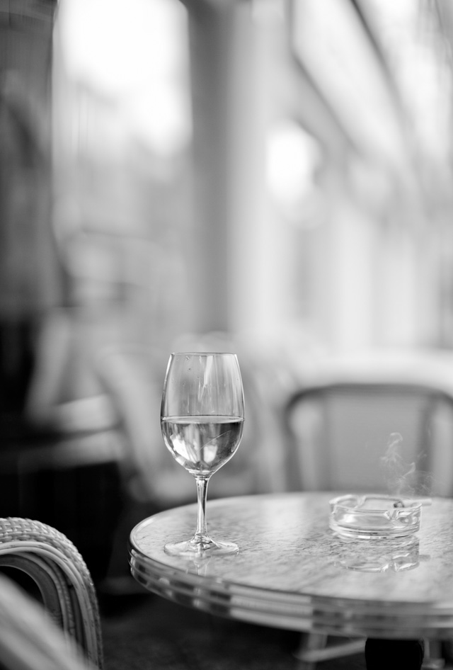 Berlin is not Berlin without a visit to Paris Bar in Kantstrasse 151. Water and a cigaret outside. Leica M Type 240 with Leica 50mm Noctilux-M ASPH f/0.95.