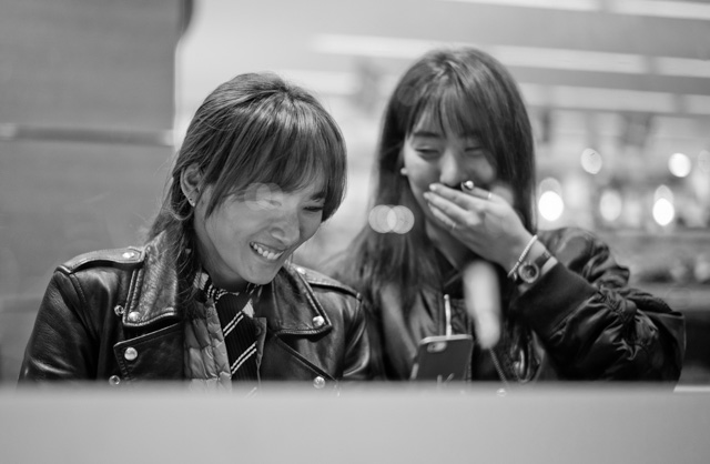 Checking something or somebody out on their smartphone. Shibuya-ku, Japan. Leica M-D 262 with Leica 50mm Summilux-M ASPH f/1.4 Black Chrome. © 2016 Thorsten Overgaard. 