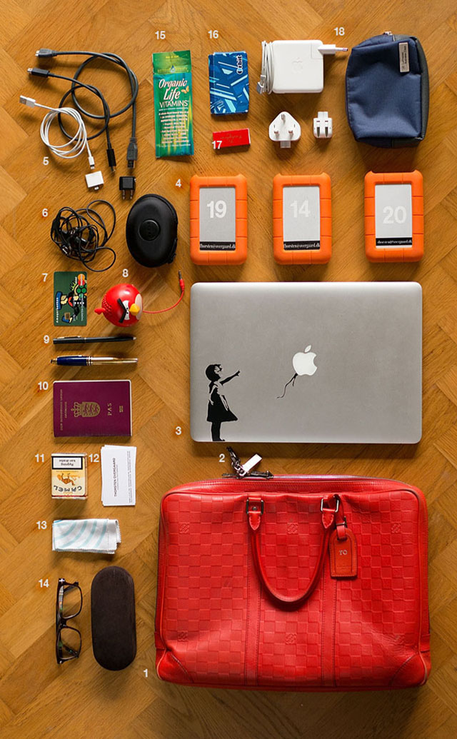 The Louis Vuitton Porte-Documents-Voyage in Fusion Orange has served as my computer bag for 6-7 years.