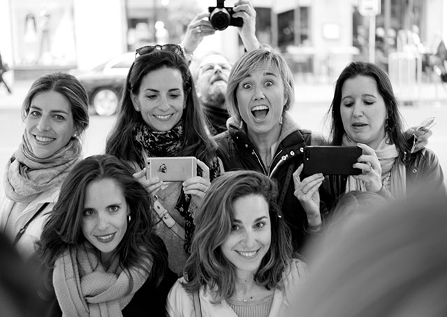 Smartphones are easy to use to get photos, but a real camera can just make things so much better. © Thorsten Overgaard (photographing a group of girlfriends in Paris in a mirror).
