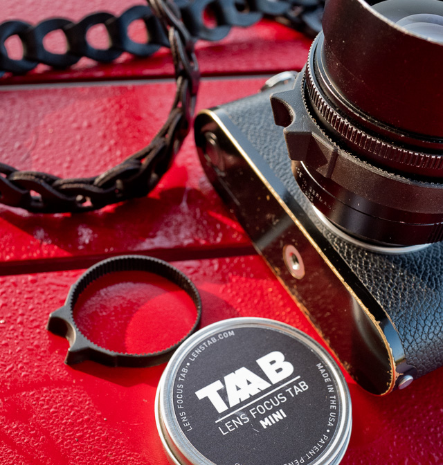 The TAAB on my Noctilux and the mini for 35mm and similar lenses on the table. It comes in a nice metal can. The TAAB can become addictive and have some advantages I think. But it is also a different material than what the lens and camera usually is made of. Try it and decide for yourself. The camera strap is the Rock'n'Roll Chain black leather strap from Tie Her Up in Greece. © 2015 Thorsten Overgaard. 