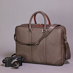 "Hemingway" messenger bag in Taupe color. 