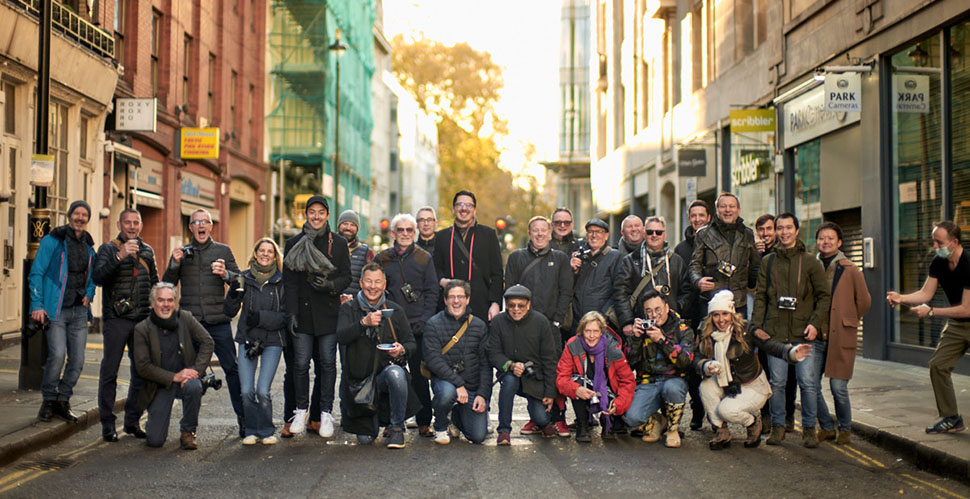 London, Sunday November 21, 2021 at 7:30 AM: The Thorsten Overgaard "Walk with Me" group outside a coffee bar after a two hour sunrise walk in Soho, London. Leica SL2 with Leica 50mm Noctilux-M ASPH f/0.95. © Thorsten Overgaard.