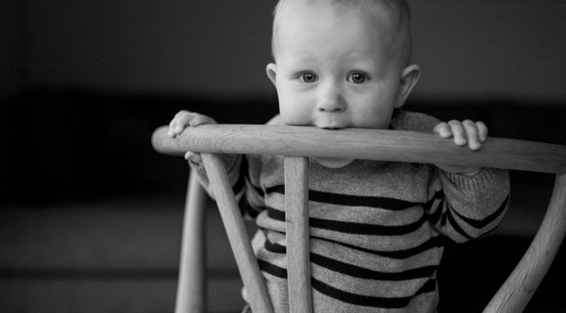 Speaking of Wegner chairs: A young man having a bite of the family's Wegner chair in their home in Denmark. Leica M9 with Leica 50mm Summicron-M f/2.0 II. © 2012-2016 Thorsten Overgaard.