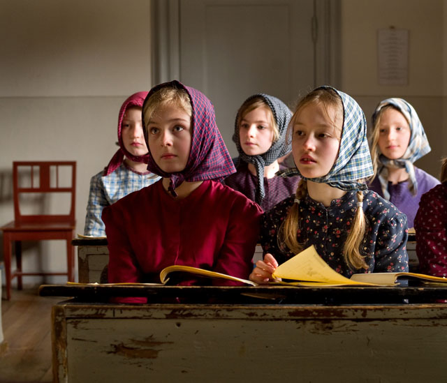 From my local reportage years: The school kids from "Rosenvangsskolen" visits The Old Town museum where they participate in s school class of 1864. They are dressed in the clothes of that time and placed like then; the kids of the finest families in front. They learn about being paddled, whipped and put in the corner. They sing the songs of that time, and also the local priest comes to examine the children. At that time Denmark was (once again) invaded and in war with Germany so that was part of the school also: "Don't talk to Germans in the streets". Leica R9/DMR. © 2008-2016 Thorsten Overgaard.