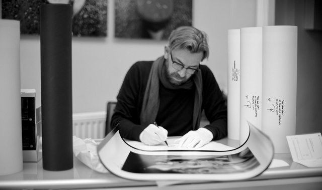 Thorsten Overgaard signing prints in Leiac Galerie Salzburg. Leica M9 with Leica 50mm Noctilux f/1.0. ©Lisa Kutzelnig.