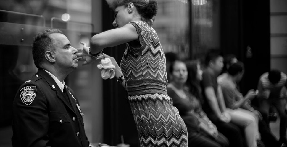 Doing makeup on NYPD officer Steven Mona before the photo shoot on 30th Street. 