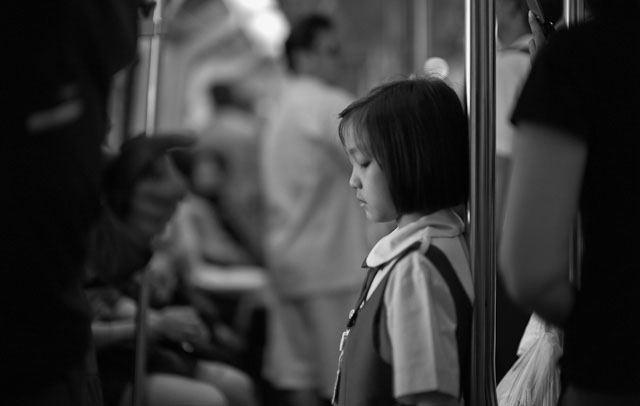 Girl in the Skytrain in Bangkok. Leica M Monochrom (2012) with Leica 50mm Noctilux-M ASPH f/0.95 (2008). 1600 ISO. © Thorsten Overgaard