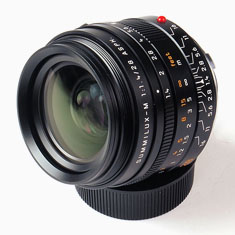 Leica 28mm Summilux-M ASPH f/1.4
(Model 11668). Pice $6,595.00 from Amazon or BHPhoto.
