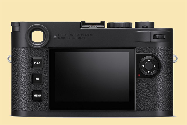 The back of the Leica M11. The little "eye to the right of the viewfinder is a light sensor to adjust the brightness of the LCD screen to the ambient light (if LCD brightness is set to "Auto" in the menus, which I recommend to be turned OFF). To the right of the screen is seen a little red LED lamp that blinks to indicate the camera is writing to the memory, or is otherwise working on waking up, etc. In the previous designs these two were places on a frame above and below the now only three buttons. New simpler design. 
