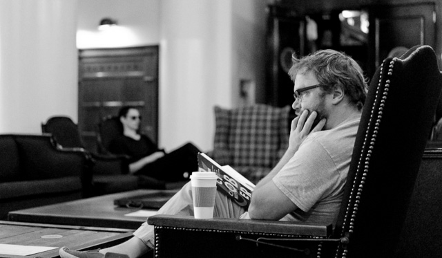 A man reading a real book without screen. Leica TL2 with Leica 35mm Summilux-TL ASPH f/1.4. 6400 ISO. © 2017 Thorsten Overgaard.