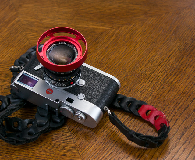 My Leica M10 in silver with the Leica 35mm Summilux-M ASPH f/1.4 AA (1990). With one of the ventilated shades I have designed (limited red E46 edition) and the Tie Her Up strap made for Leica M10.